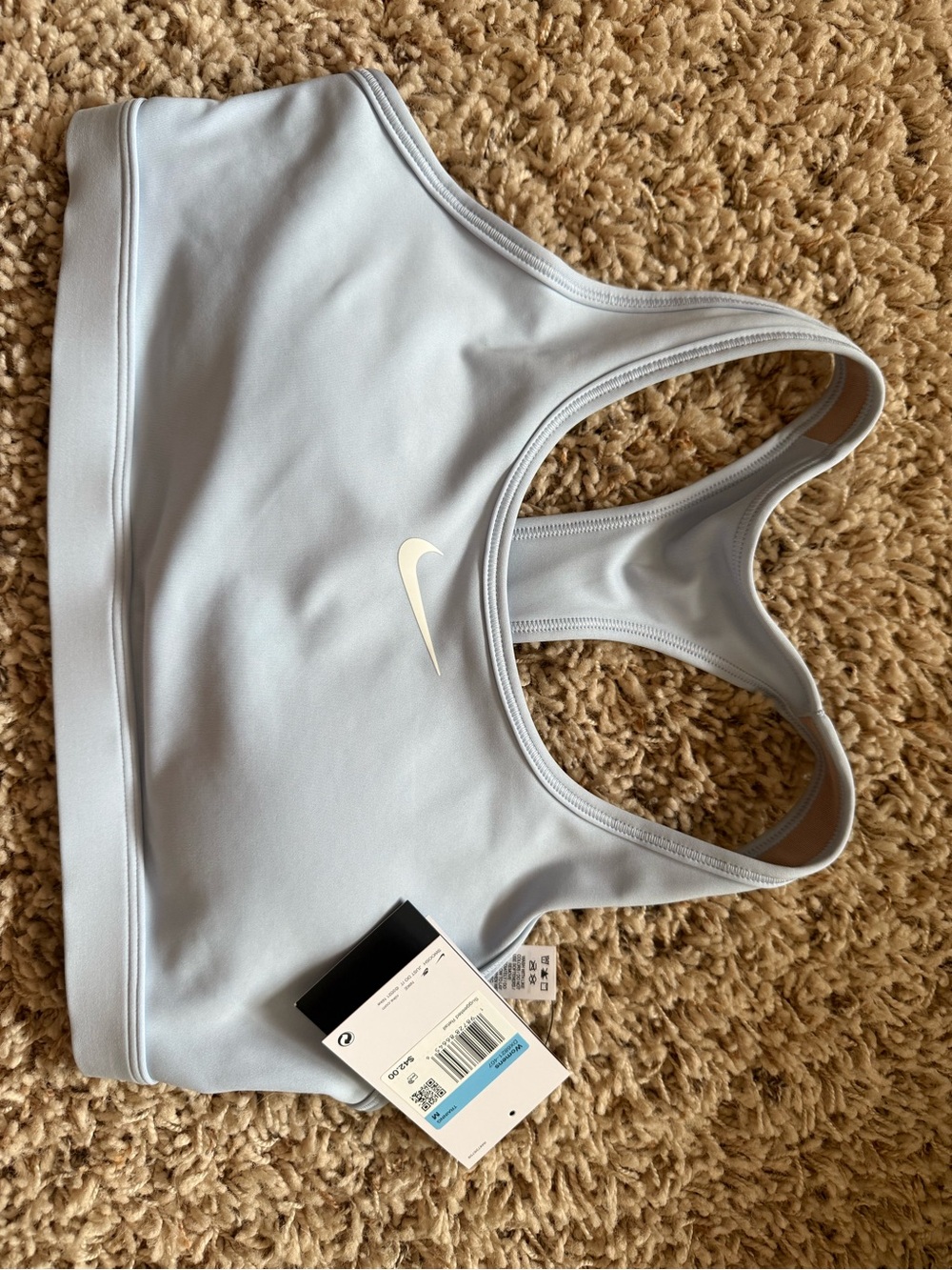 Nike Women’s Pale Blue Racerback Sports Bra with White Swoosh
